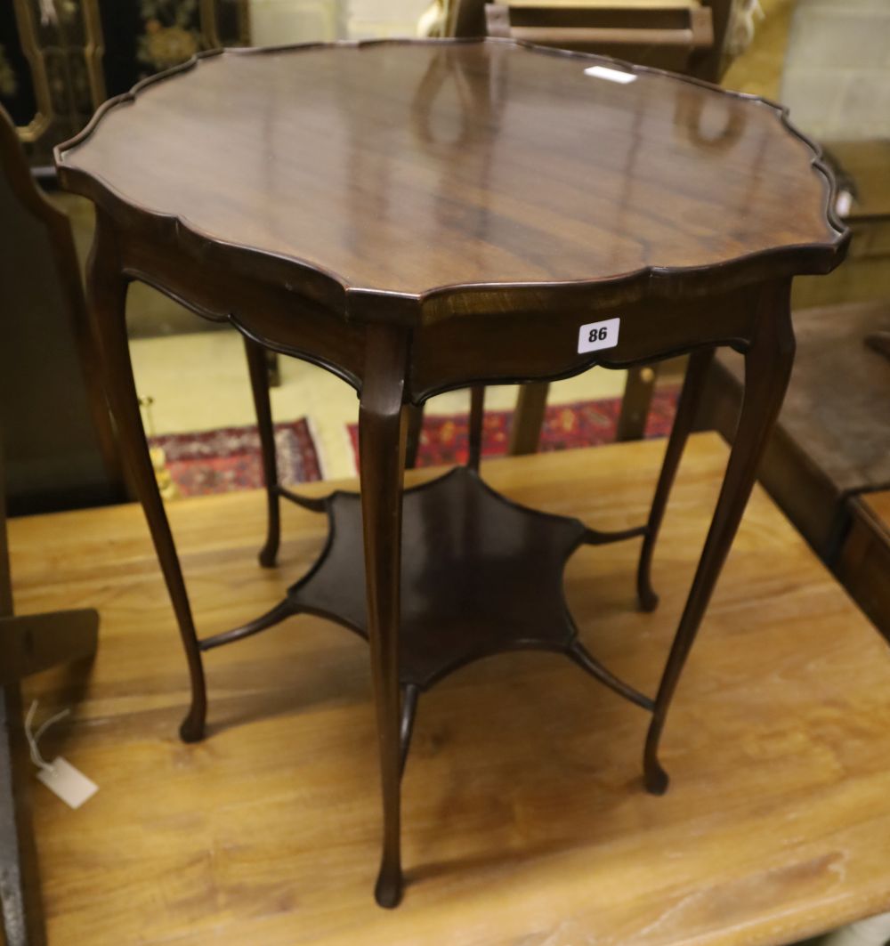 A late Victorian mahogany shaped circular topped two tier table, 67cm diameter, 72cm high